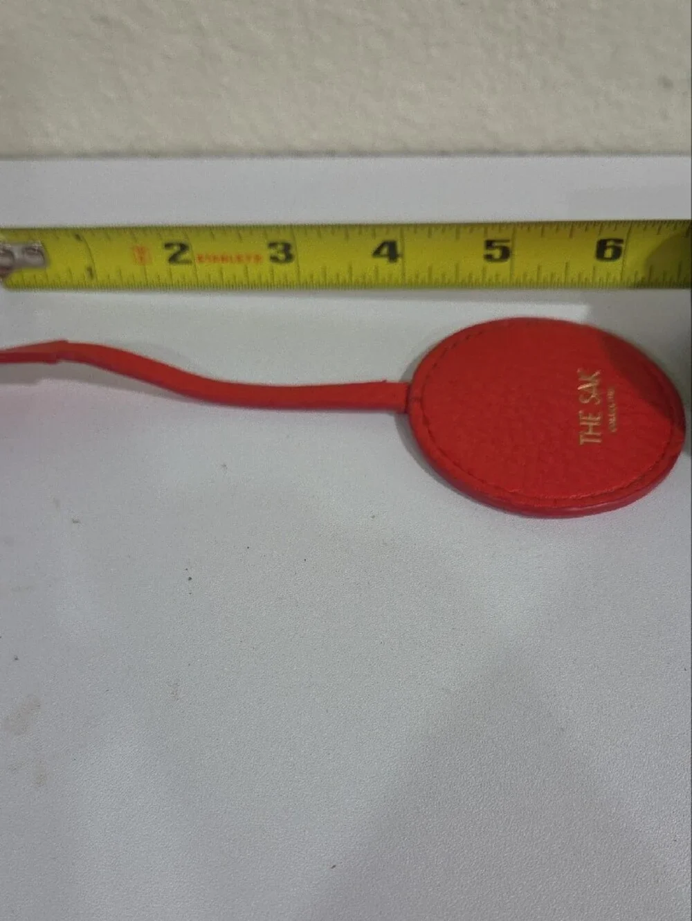The Sak Red Leather Round Hang Tag
